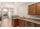 Kitchen features stainless steel appliances and a view to the dining area at 42424 N Gavilan Peak Pkwy # 57104, Anthem, AZ 85086
