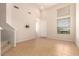 Inviting living room with abundant natural light and tile floors at 42424 N Gavilan Peak Pkwy # 57104, Anthem, AZ 85086