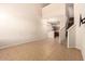 Open-concept living room features a staircase, neutral tile flooring, and high ceilings at 42424 N Gavilan Peak Pkwy # 57104, Anthem, AZ 85086