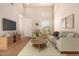 This living room features a neutral palette, sleek furnishings, and a cozy atmosphere at 42424 N Gavilan Peak Pkwy # 57104, Anthem, AZ 85086