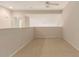 Carpeted loft space with a ceiling fan and a half wall dividing it from the rest of the house at 42424 N Gavilan Peak Pkwy # 57104, Anthem, AZ 85086