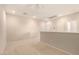 Neutral loft area featuring carpeted floors, recessed lights, and a half wall overlooking another room at 42424 N Gavilan Peak Pkwy # 57104, Anthem, AZ 85086