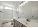 Bathroom with double sink vanity, large mirror and tile tub/shower combo at 44538 W Canyon Creek Dr, Maricopa, AZ 85139