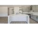 Open-concept kitchen with a large island, stainless steel appliances, and gray cabinetry at 44538 W Canyon Creek Dr, Maricopa, AZ 85139