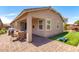 Backyard features a covered patio, artificial grass, outdoor seating, and a grill at 45424 W Norris Rd, Maricopa, AZ 85139