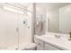 Bright bathroom features a modern walk-in shower and a sleek vanity at 45424 W Norris Rd, Maricopa, AZ 85139