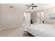 Spacious bedroom with neutral walls, soft carpet, and access to a hallway and bathroom at 45424 W Norris Rd, Maricopa, AZ 85139