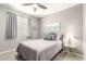 Well-lit bedroom with a comfortable bed, stylish decor, and a view of the window at 45424 W Norris Rd, Maricopa, AZ 85139