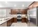 Well-lit kitchen featuring stainless steel appliances and plenty of counter space at 45424 W Norris Rd, Maricopa, AZ 85139