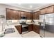 Stylish kitchen featuring stainless steel appliances and ample cabinet space at 45424 W Norris Rd, Maricopa, AZ 85139