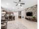 Open-concept living room featuring tile floors and a modern stone accent wall at 45424 W Norris Rd, Maricopa, AZ 85139