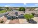 Charming home featuring a tile roof, desert landscaping, and a three-car garage, set in a well-maintained neighborhood at 5529 E Holmes Ave, Mesa, AZ 85206