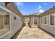 View of private courtyard featuring a tile walkway and entry to the main house at 5529 E Holmes Ave, Mesa, AZ 85206