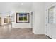 Bright living area featuring tile flooring, white door, and light-filled space at 5529 E Holmes Ave, Mesa, AZ 85206