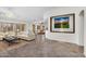 Open living room features tile floors, white walls, plantation shutters, and an open floorplan at 5529 E Holmes Ave, Mesa, AZ 85206