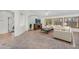 Cozy living room features neutral furniture, shutters, and tiled floors at 5529 E Holmes Ave, Mesa, AZ 85206