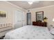 A comfortable bedroom with natural light, a double closet, and a calming interior design at 5613 E Calle Del Paisano --, Phoenix, AZ 85018