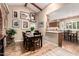 Cozy dining room featuring hardwood floors, vaulted ceilings with wooden beams, and warm, neutral tones at 5613 E Calle Del Paisano --, Phoenix, AZ 85018