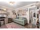 Comfortable living room with a green sofa, shelving, and an eye-catching gallery wall at 5613 E Calle Del Paisano --, Phoenix, AZ 85018