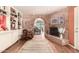 Elegant living room featuring a brick archway, a fireplace, and custom built-in shelving at 5613 E Calle Del Paisano --, Phoenix, AZ 85018