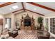 Relaxing living room area with vaulted ceilings, skylight, and an entertainment center at 5613 E Calle Del Paisano --, Phoenix, AZ 85018