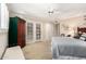 Large primary bedroom featuring a ceiling fan, French doors, and a decorative armoire at 5613 E Calle Del Paisano --, Phoenix, AZ 85018