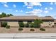 Back exterior of a single Gathering home with desert landscaping along the back of the home at 6205 W Encinas Ln, Phoenix, AZ 85043
