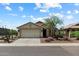 Inviting single-story home with desert landscaping, an attached garage, and a well-maintained front yard at 6205 W Encinas Ln, Phoenix, AZ 85043