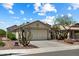 Charming single-story home featuring a two-car garage, desert landscaping, and a welcoming facade at 6205 W Encinas Ln, Phoenix, AZ 85043