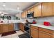 Well-lit kitchen featuring stainless steel appliances, ample counter space, and wood-toned cabinetry at 6205 W Encinas Ln, Phoenix, AZ 85043