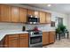 Modern kitchen featuring stainless steel appliances, abundant storage, and ample counter space for food preparation at 6205 W Encinas Ln, Phoenix, AZ 85043