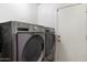 Laundry room equipped with modern, front-load washer and dryer units for convenient chore management at 6205 W Encinas Ln, Phoenix, AZ 85043