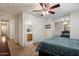 Bright main bedroom featuring an attached bathroom, creating a private and convenient living space at 6205 W Encinas Ln, Phoenix, AZ 85043