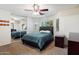 Relaxing main bedroom with a mirrored closet, ceiling fan, and natural light from bay windows at 6205 W Encinas Ln, Phoenix, AZ 85043