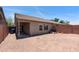 View of the home's backyard with desert landscaping and block wall fencing at 6610 E University Dr # 163, Mesa, AZ 85205
