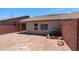 View of the home's backyard with desert landscaping and block wall fencing at 6610 E University Dr # 163, Mesa, AZ 85205