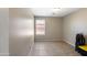 Cozy bedroom with tile floors and a bright window at 6610 E University Dr # 163, Mesa, AZ 85205