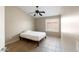 Bedroom features a ceiling fan and window at 6610 E University Dr # 163, Mesa, AZ 85205