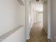 Inviting hallway with neutral walls and tile flooring, leading into the home's living spaces at 6610 E University Dr # 163, Mesa, AZ 85205
