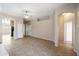 Open living space with tile floors and arched doorways for seamless flow at 6610 E University Dr # 163, Mesa, AZ 85205