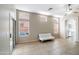 Bright living room featuring tile floors, ample natural light, and a sliding glass door at 6610 E University Dr # 163, Mesa, AZ 85205