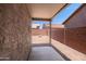Covered patio with a concrete floor and stucco walls, providing a comfortable outdoor space at 6610 E University Dr # 163, Mesa, AZ 85205