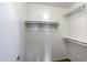 Walk-in closet with shelves and hanging rods at 6610 E University Dr # 163, Mesa, AZ 85205