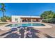 Beautiful backyard boasts a refreshing pool and modern home, ideal for Gathering fun at 6615 E Phelps Rd, Scottsdale, AZ 85254