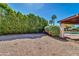 Private backyard featuring lush greenery, gravel, and a view of the sparkling pool at 6615 E Phelps Rd, Scottsdale, AZ 85254