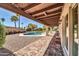 Inviting backyard features a covered patio and refreshing pool, ideal for outdoor relaxation at 6615 E Phelps Rd, Scottsdale, AZ 85254