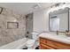 Bright bathroom featuring marble tiled walls, updated fixtures, and a modern vanity at 6615 E Phelps Rd, Scottsdale, AZ 85254
