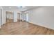 Spacious bedroom with hardwood floors, mirrored closet doors, and an exterior door at 6615 E Phelps Rd, Scottsdale, AZ 85254