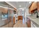 Modern kitchen with stainless steel appliances, updated cabinets, and a sleek countertop at 6615 E Phelps Rd, Scottsdale, AZ 85254