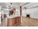 Well-appointed kitchen with stainless steel appliances, custom cabinetry, and a breakfast bar at 6615 E Phelps Rd, Scottsdale, AZ 85254